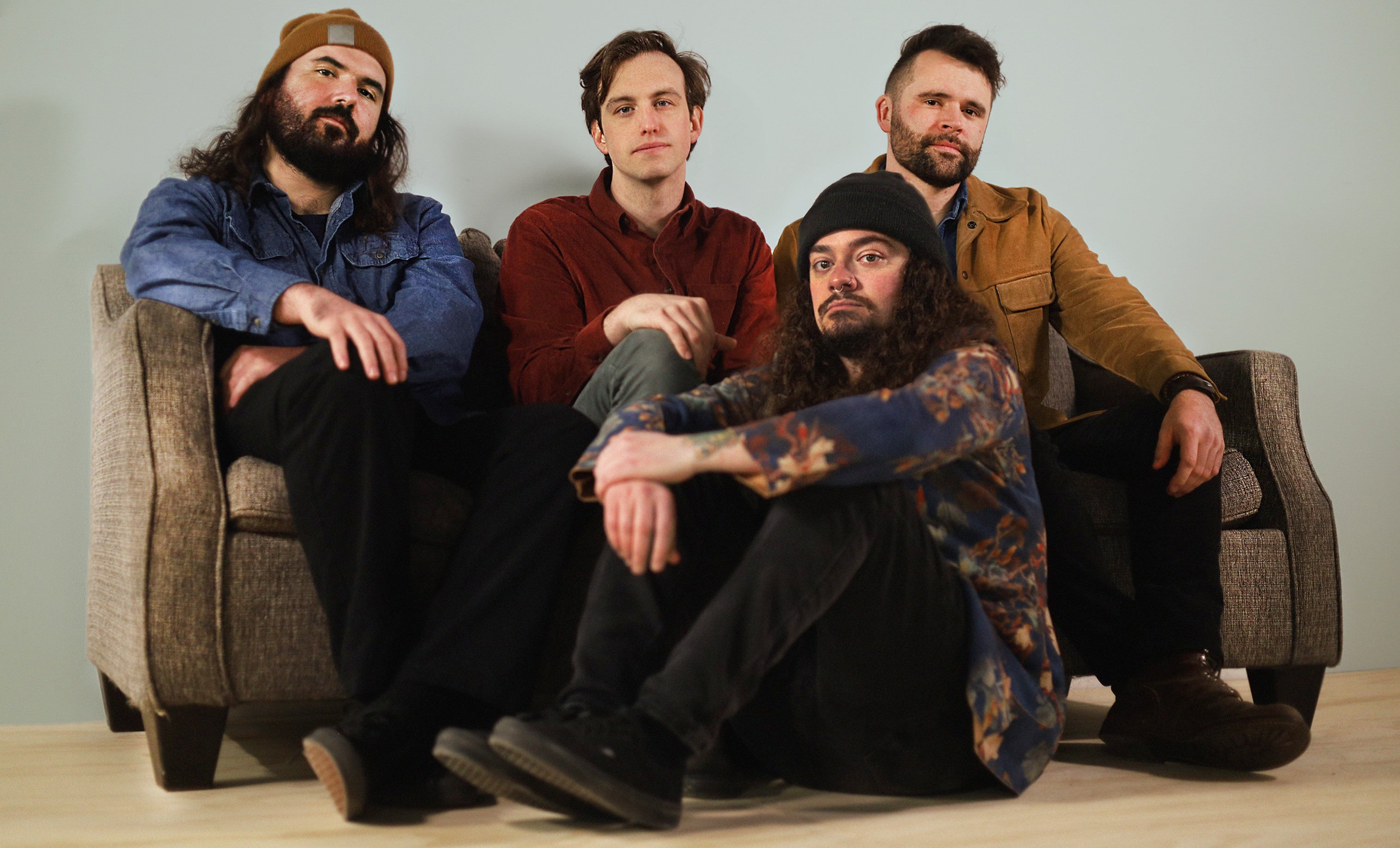 The Rollin' Rust band sitting on a couch